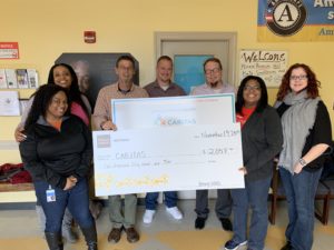 wells fargo presenting check to caritas